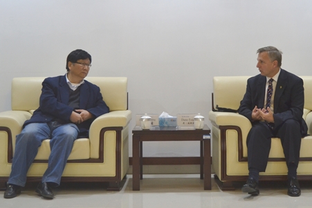 Foust (right) with West Anhui University's Provost
